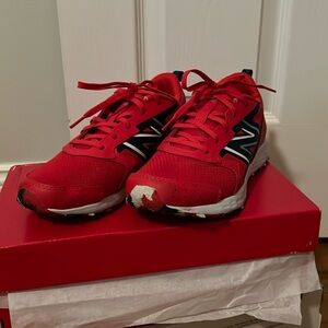 Red New Balance youth running shoes